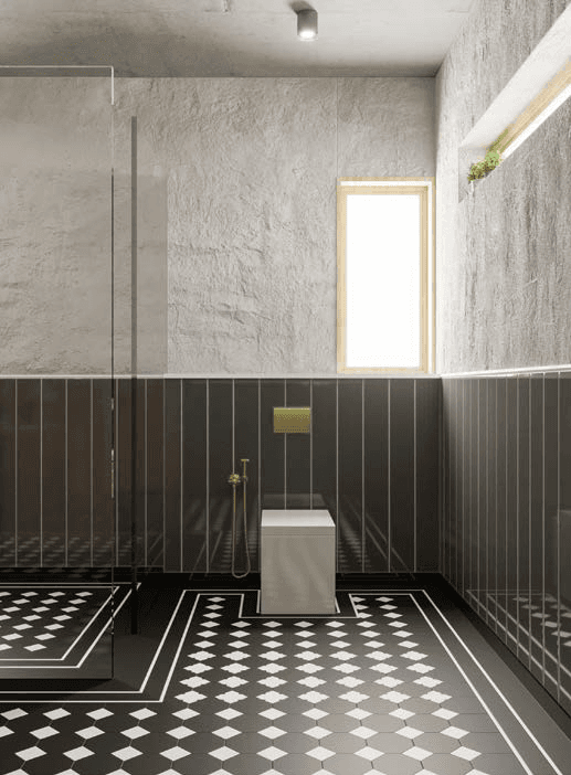 Master bathroom — textured stone walls, checkerboard floor inlay, brass hardware, marble seat
